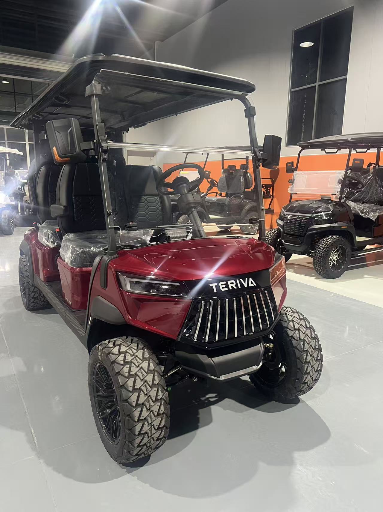 TERIVA red cart in showroom, front three-quarter view